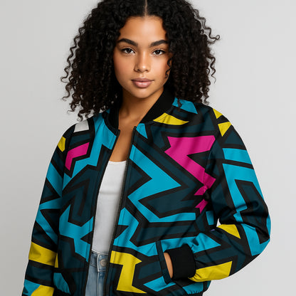 Woman wearing a colorful geometric-patterned jacket on a gray background