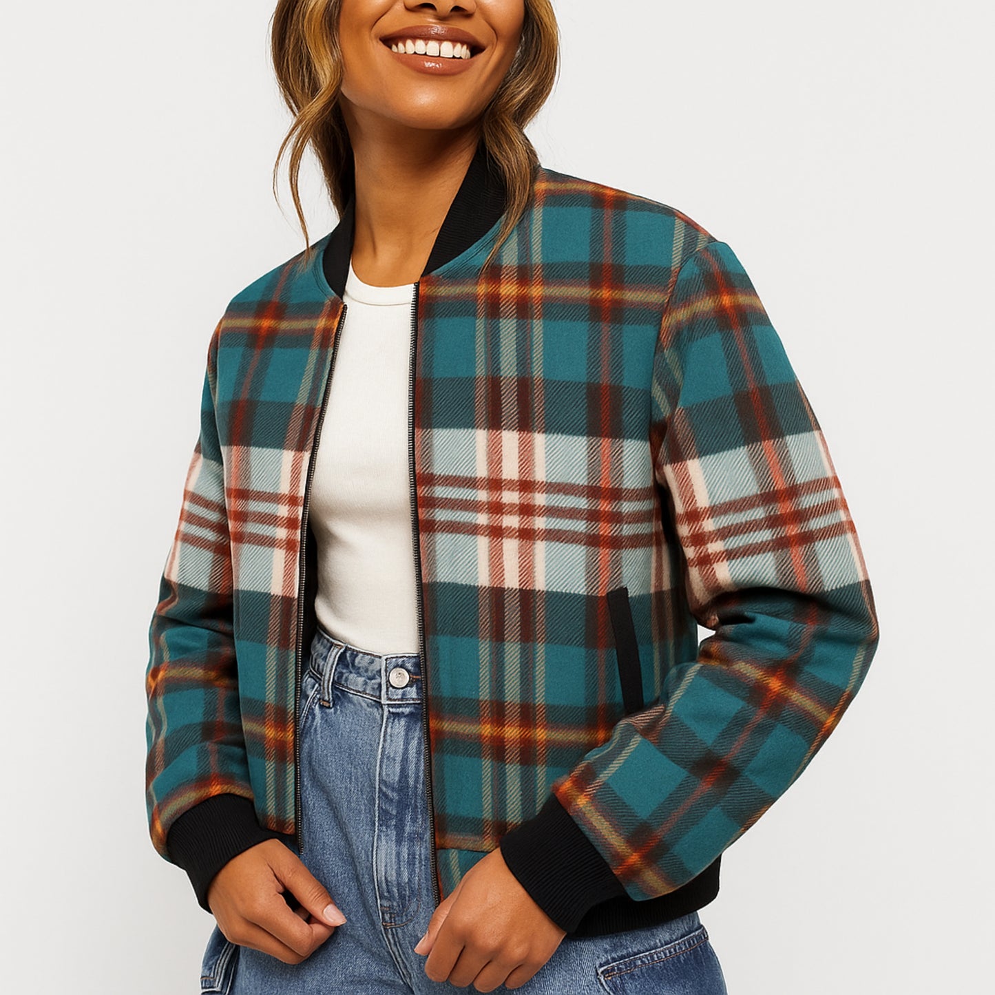 Person wearing a plaid jacket with a white background