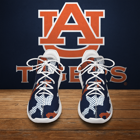 Navy and orange sneakers with white laces on a wooden surface in front of an Auburn Tigers logo.