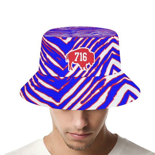 Bucket hat with blue, red, and white pattern worn by a person on a white background