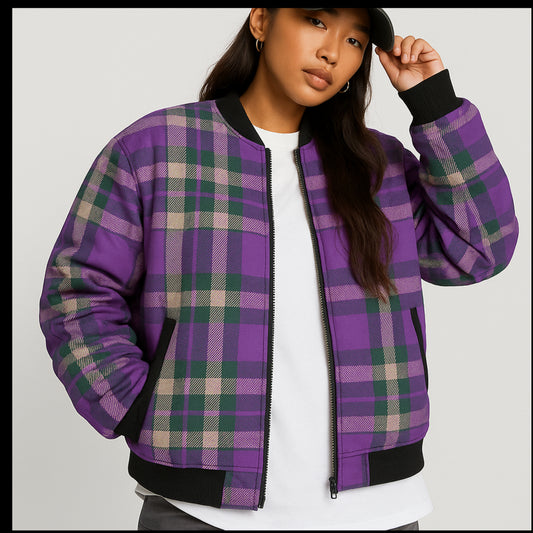 Woman wearing a purple and green plaid jacket in an autumn forest setting