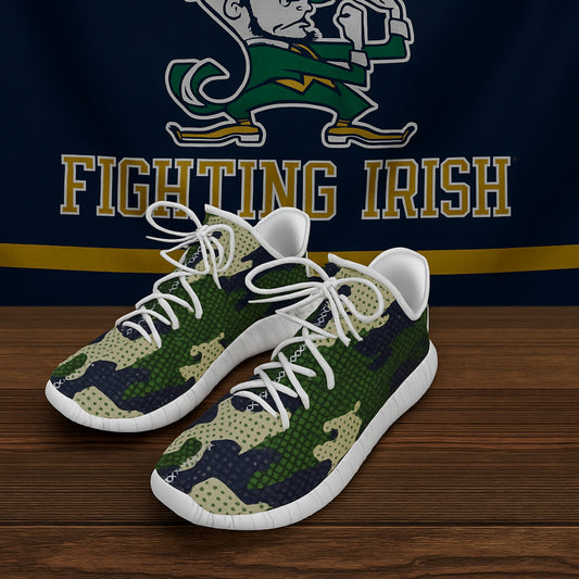Green and white sneakers with 'Fighting Irish' logo in the background