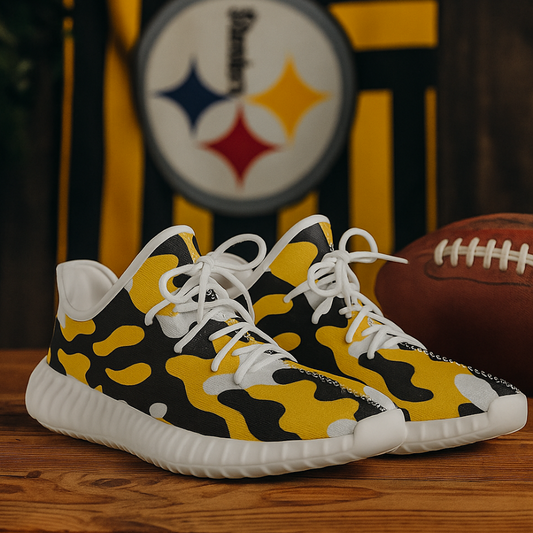 Yellow and black camouflage sneakers with white laces on a wooden surface, with a football and sports team logo in the background.