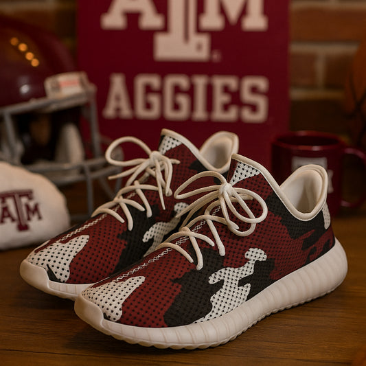 Camouflage sneakers with white laces on a wooden surface, with 'ATM Aggies' sign in the background.