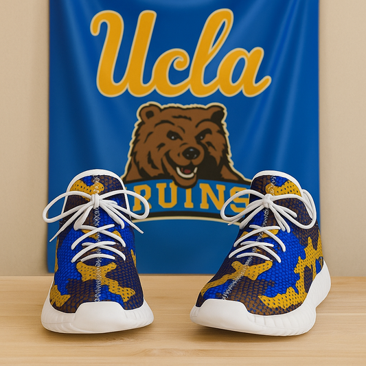 Pair of blue and yellow sneakers with white laces in front of a UCLA banner.